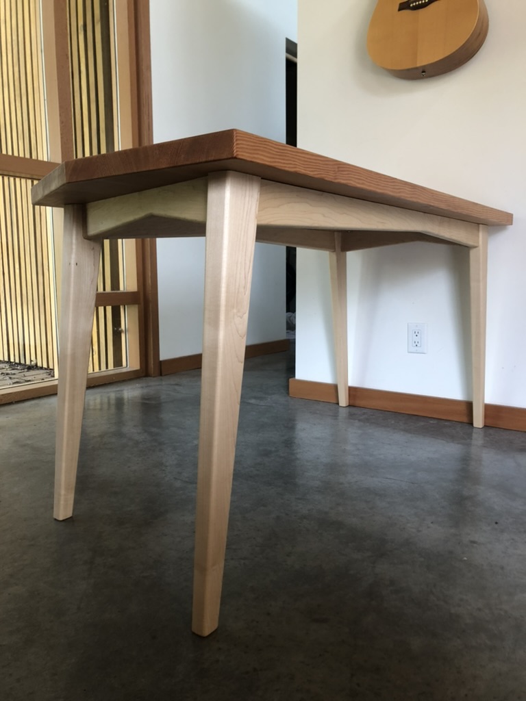 Handcrafted maple and cherry dining table with tapered legs